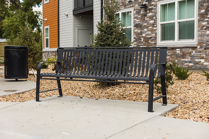 Metro Bench with back at apartment complex.